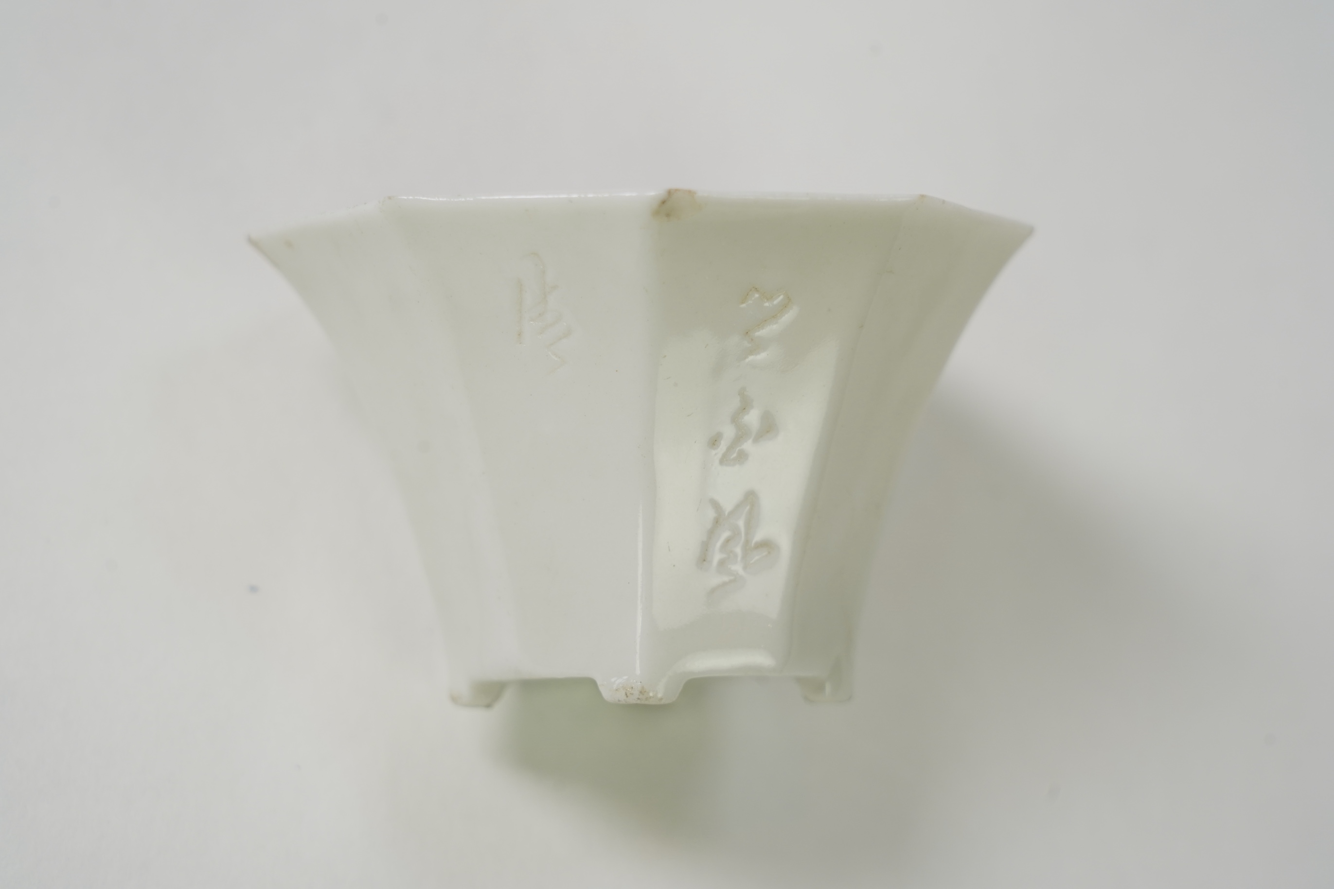 Two Chinese Dehua blanc de chine octagonal cups, Kangxi period